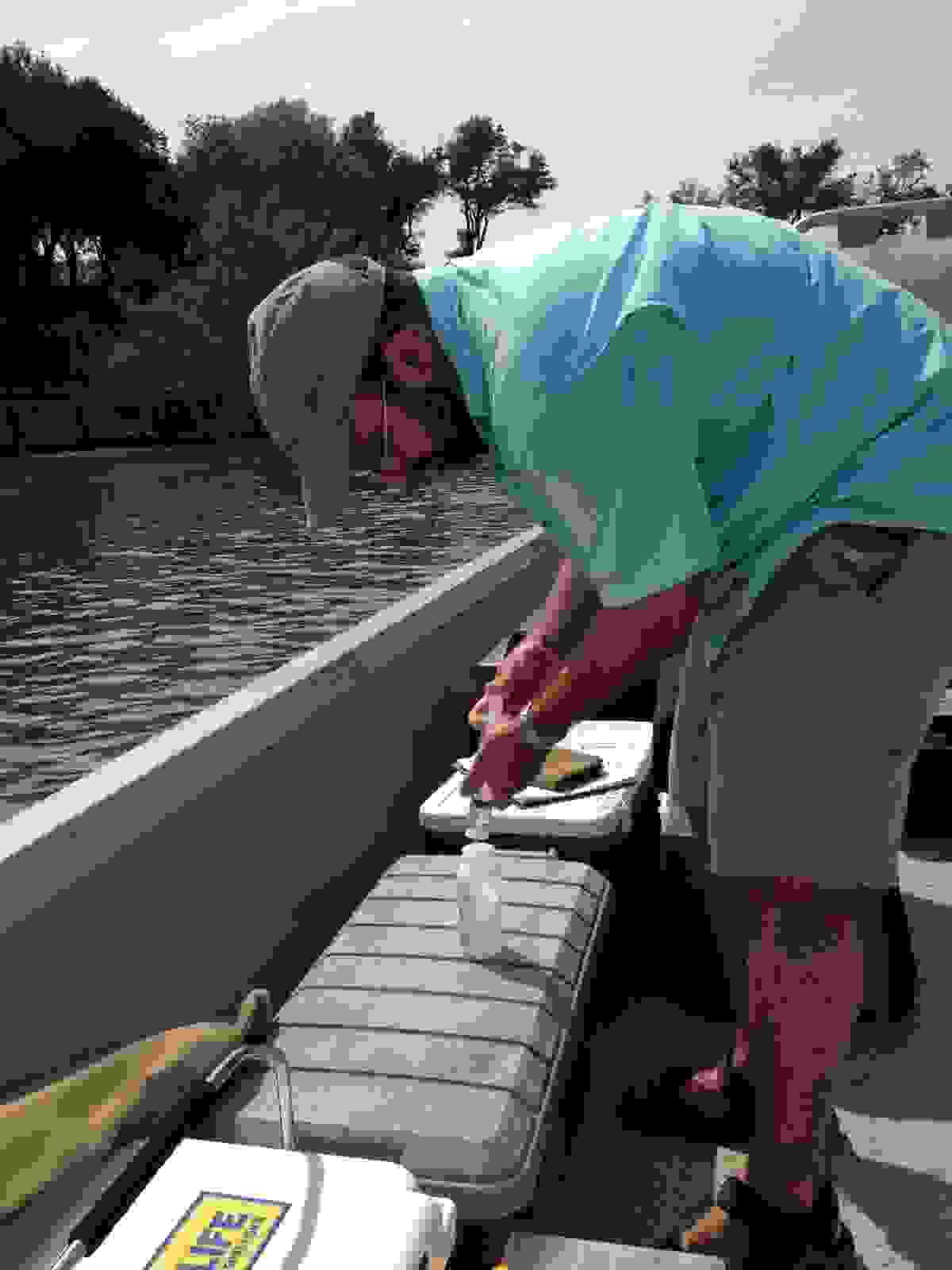 Dr. Jude Benavides collects water quality samples within the tidal portion of the Arroyo Colorado.