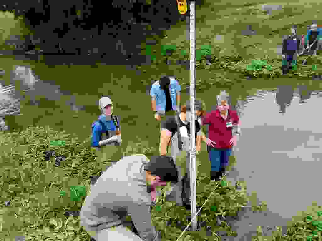 A cross-section survey, performed by participants at an Urban Riparian and Stream Restoration educational program. Photo courtesy of Alexander Neal.