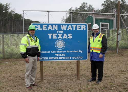 Phil Smith, (left) construction manager for the San Jacinto River Authority’s technical services department, stands with Texas Water Development Board Chairman Carlos Rubinstein (right), at the construction site of one of the river authority’s projects to develop adequate surface water supplies. The board provided financial assistance for the project.
