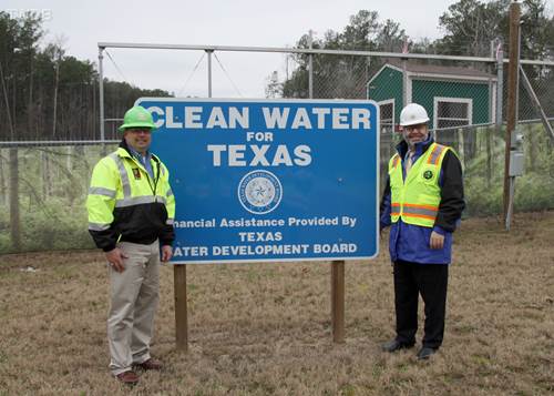 Phil Smith, (left) construction manager for the San Jacinto River Authority’s technical services department, stands with Texas Water Development Board Chairman Carlos Rubinstein (right), at the construction site of one of the river authority’s projects to develop adequate surface water supplies. The board provided financial assistance for the project. 