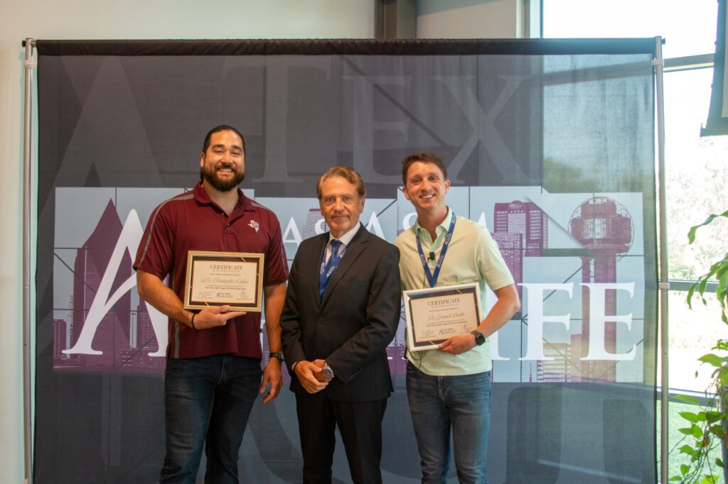 Christopher Cobos (left) and Joseph Burke, Ph.D., were honored for leading symposium organizing.